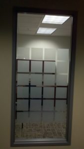 Creative blocking pattern to create privacy to this office door entrance.