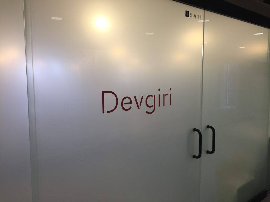 Example of WFD project with cut lettering and corporate logos applied to the glass surface: Devgiri
